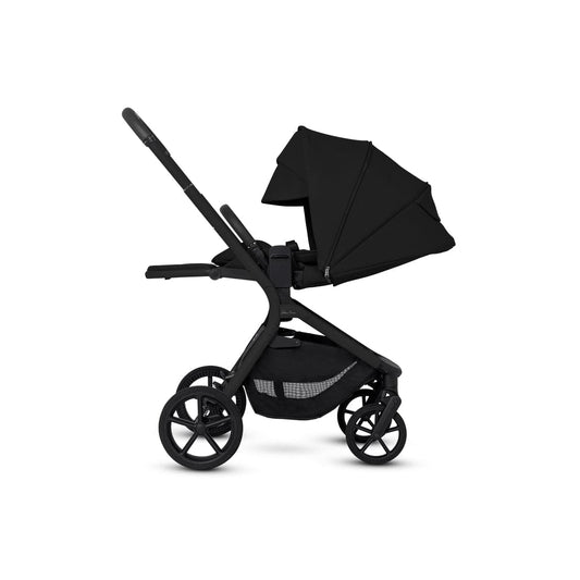 Onyx modular stroller by Silver Cross, sleek black frame with canopy, five-spoke wheels, side view, textured fabric seat and storage basket