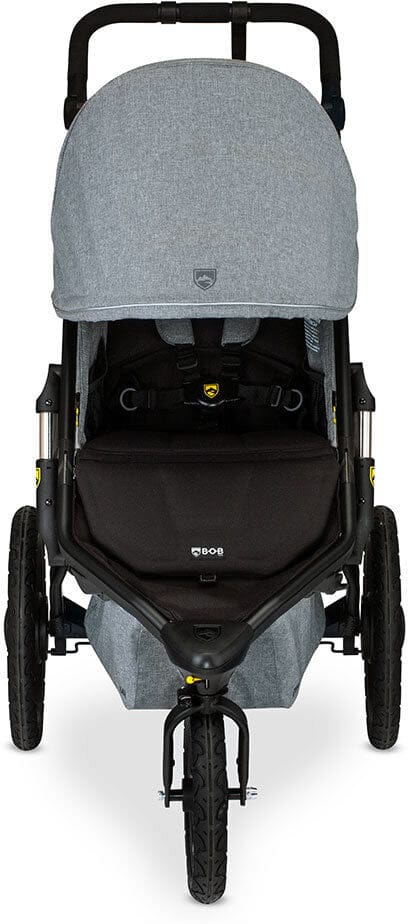 Melange gray jogging stroller by BOB with black frame, large all-terrain wheels, and adjustable canopy, side view