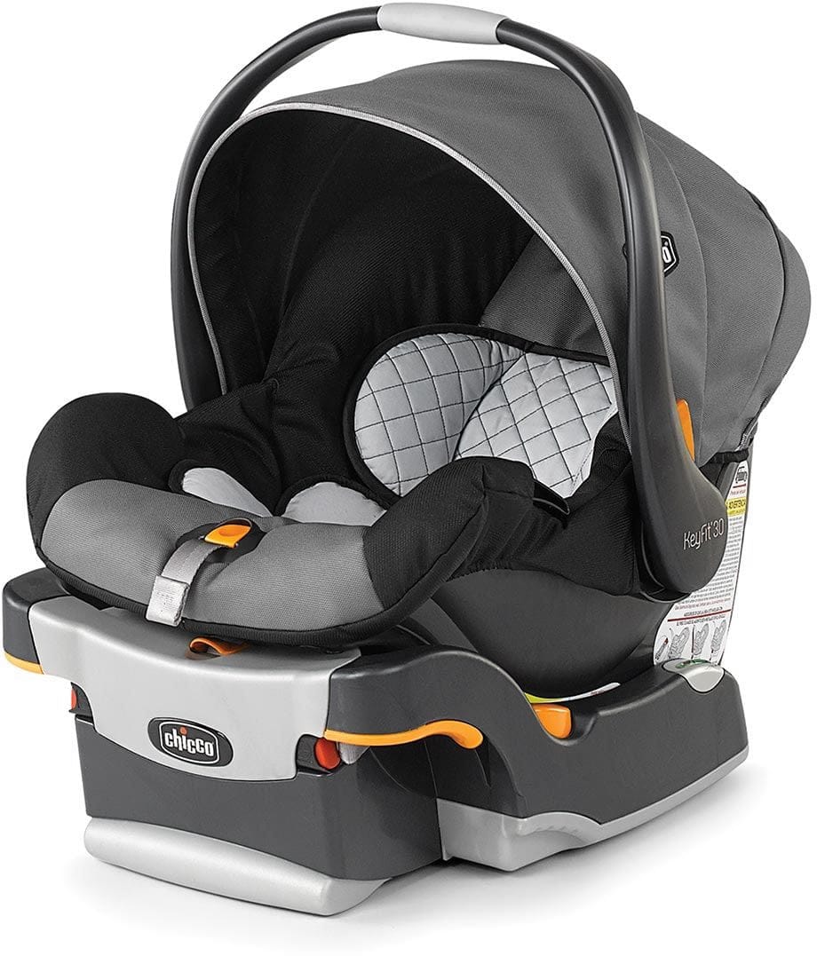 Gray and black infant car seat with quilted headrest and orange accents by Chicco, shown from front three-quarter view with canopy open