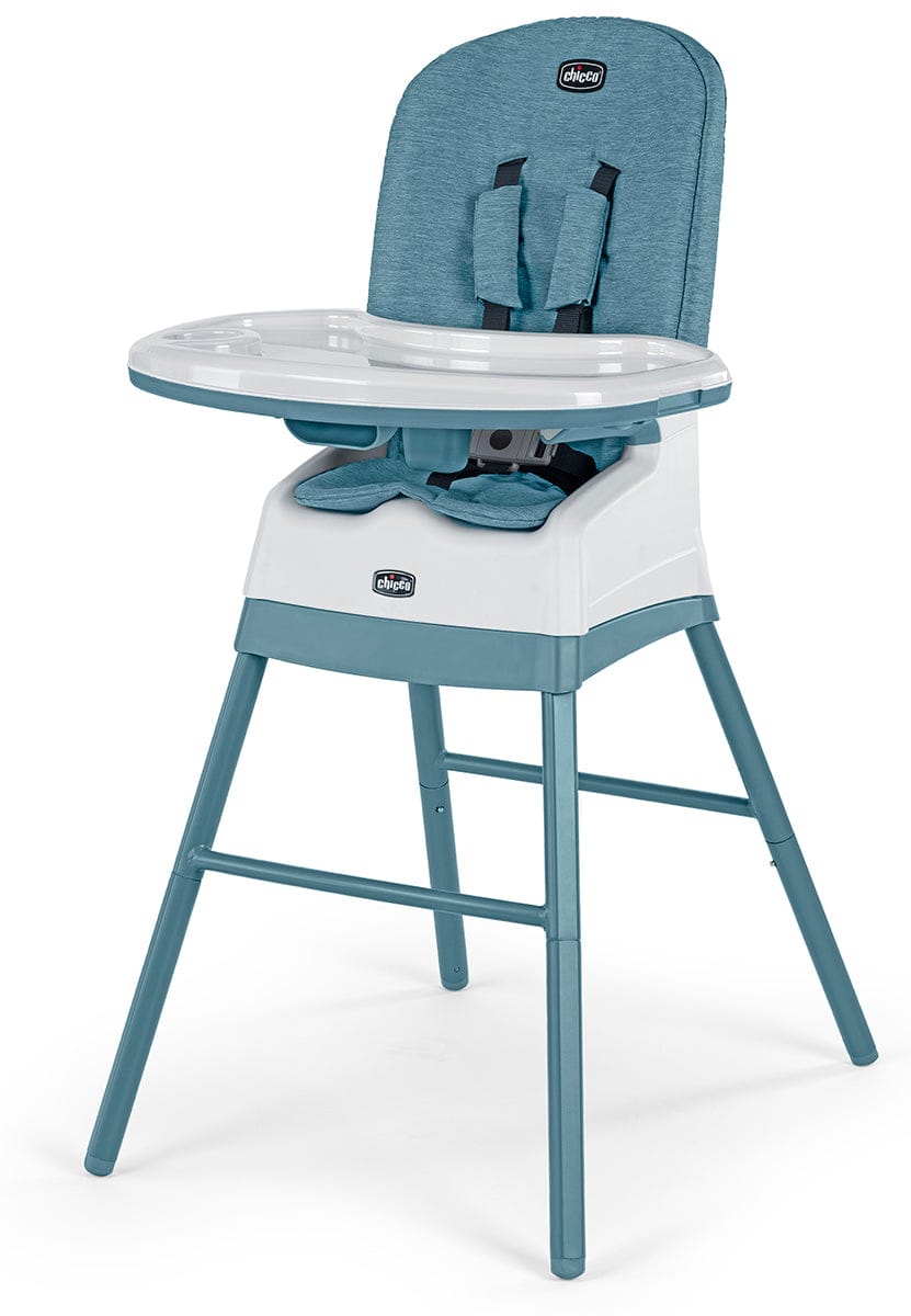 Teal and white multi-use high chair by Chicco with textured fabric, adjustable harness, and removable tray, front view.