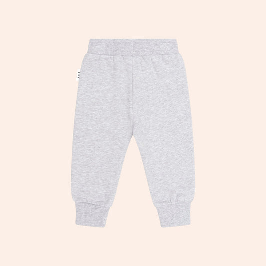 Huxbaby grey sweatpants with bear face patches on knees