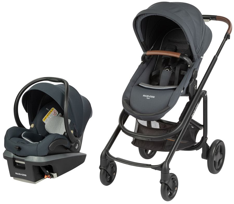 Graphite Maxi-Cosi travel system with infant car seat and stroller, featuring black frame, brown leatherette handle, and mesh storage basket, side view