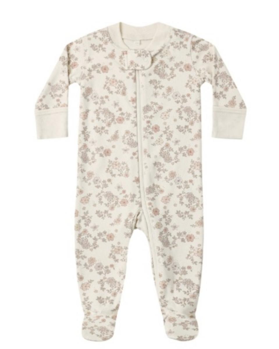 Quincy Mae long sleeve footed sleeper in cream with a small floral print and front zipper closure