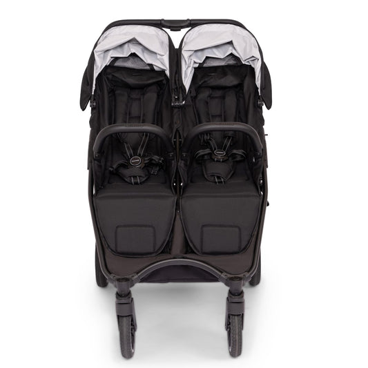 Valco Baby Slim Twin double stroller in black with dual canopies and storage basket
