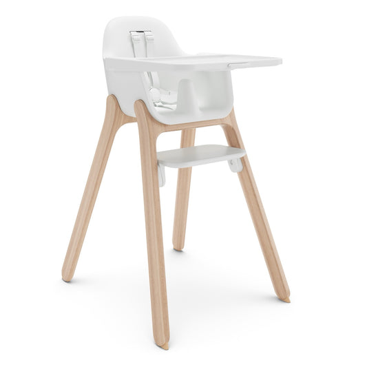 UPPAbaby white high chair with light wood legs and a tray