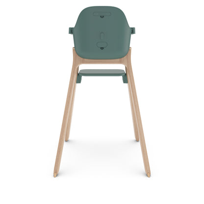 Back view of UPPAbaby high chair with green seat and wooden legs