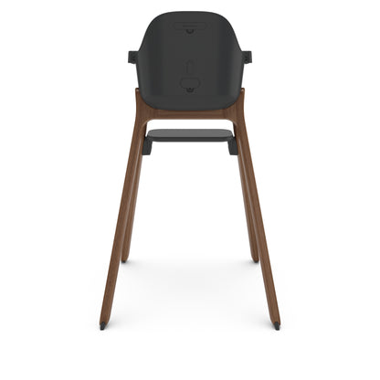 Back view of UPPAbaby high chair with dark grey seat and wooden legs