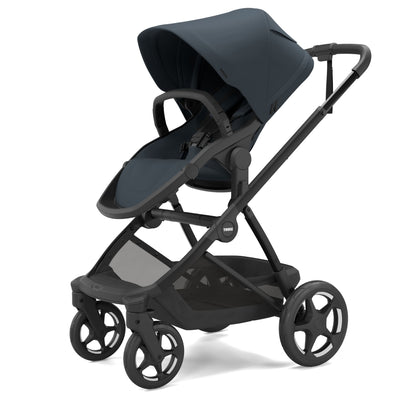 Thule Sleek stroller in navy blue with black frame and storage basket