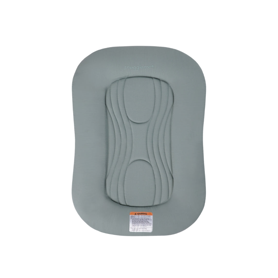 Sage green Snuggle Me infant lounger with central quilted pad and safety warning label