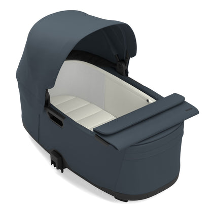 Thule blue bassinet with white interior lining and canopy