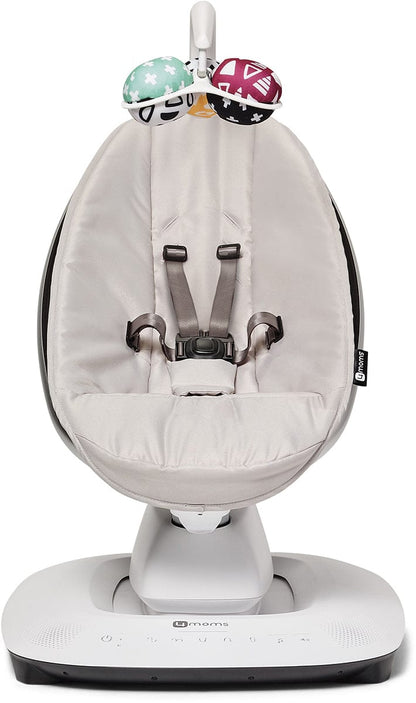 Grey multi-motion baby swing by 4moms with padded seat, five-point harness, and colorful toy bar, front view