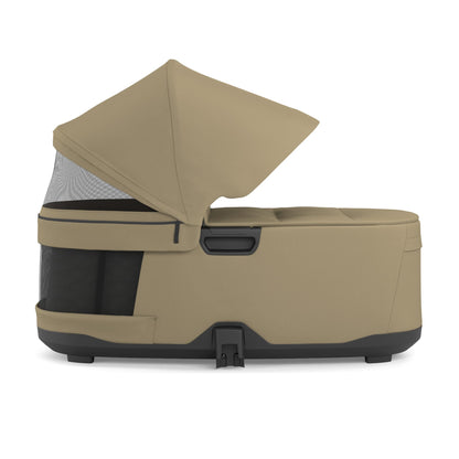 Tan stroller bassinet with mesh ventilation panel and canopy