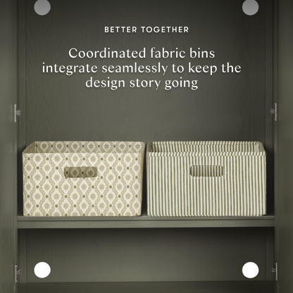 Babyletto fabric storage bins with patterned and striped designs on a shelf