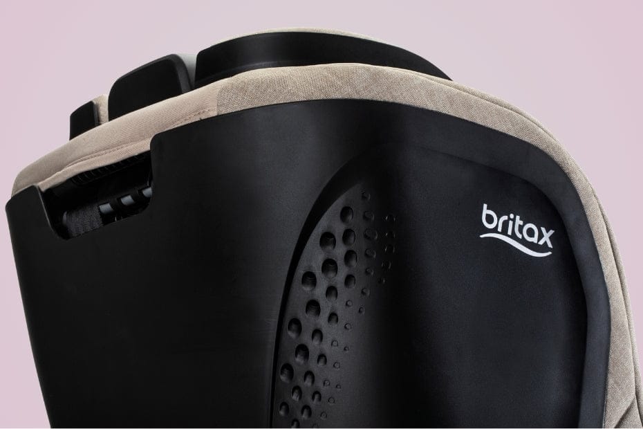 Close-up of a black and beige Britax car seat with ventilation holes and the Britax logo.