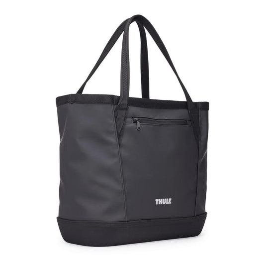 Black Thule Chasm Gear Tote 30L by Thule, durable nylon tote with front zip pocket and reinforced base, front view