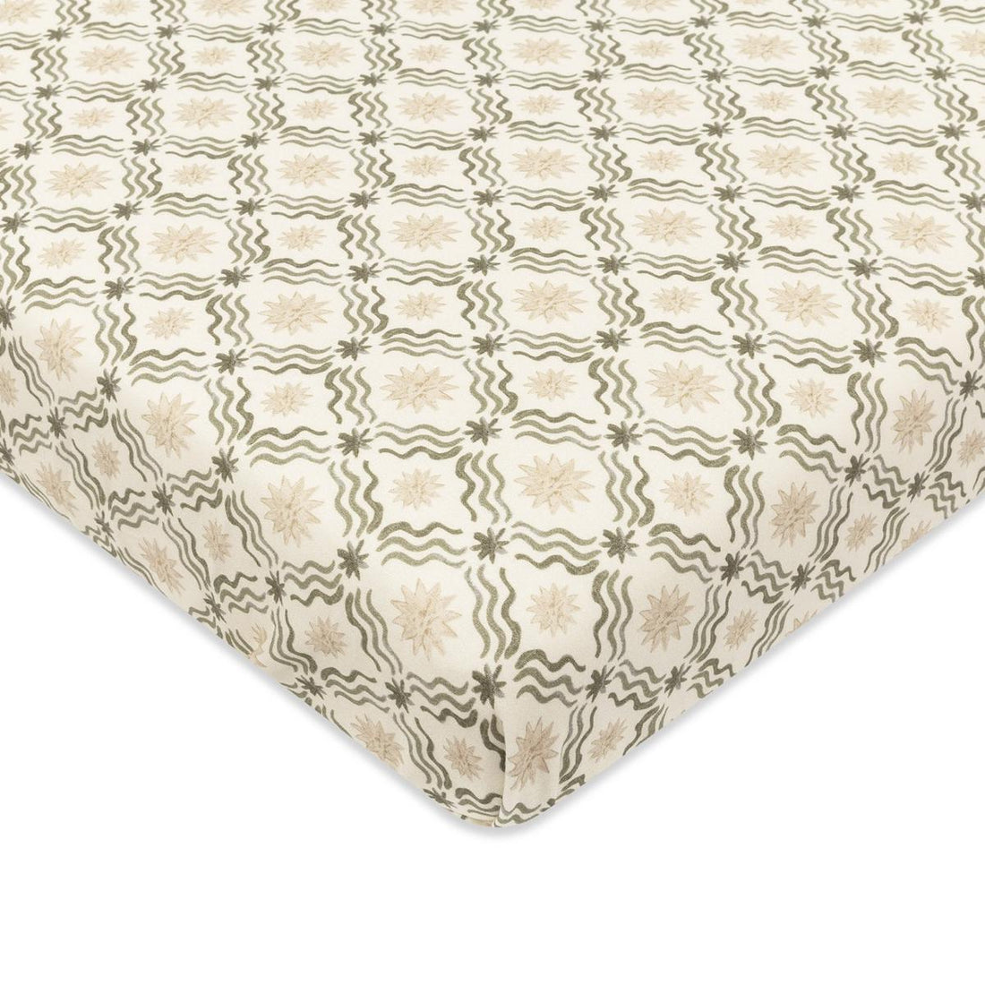 Babyletto crib sheet with cream background and repeating olive green wavy line and star pattern