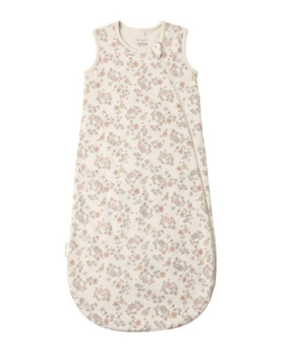 Sleeveless baby sleep bag in cream with a delicate floral print