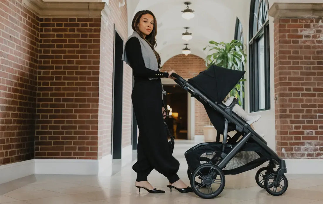 woman standing with stroller in james colorway from uppababy in hallway