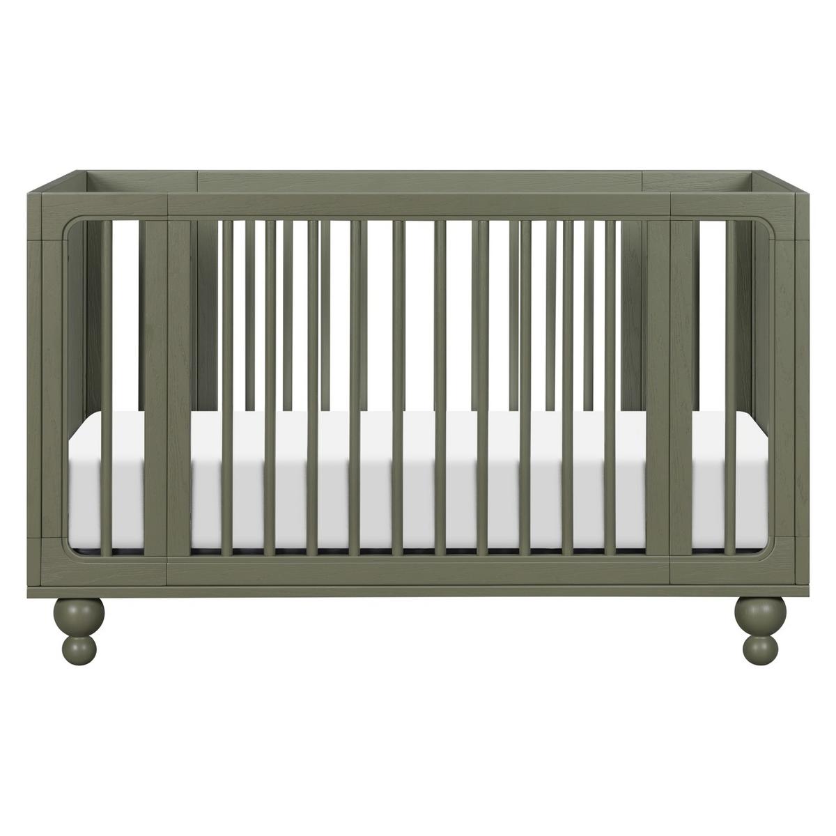 Babyletto olive green wooden crib with vertical slats and round feet