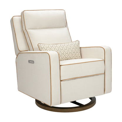 Babyletto cream swivel glider recliner with tan piping and patterned lumbar pillow