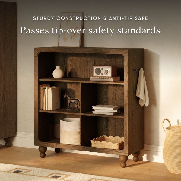 Babyletto wooden bookshelf with four storage compartments and rounded feet