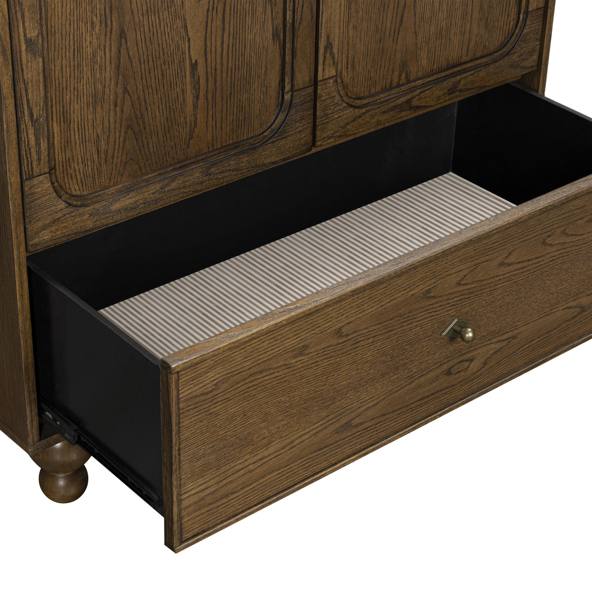 Babyletto dresser with open drawer showing striped interior lining