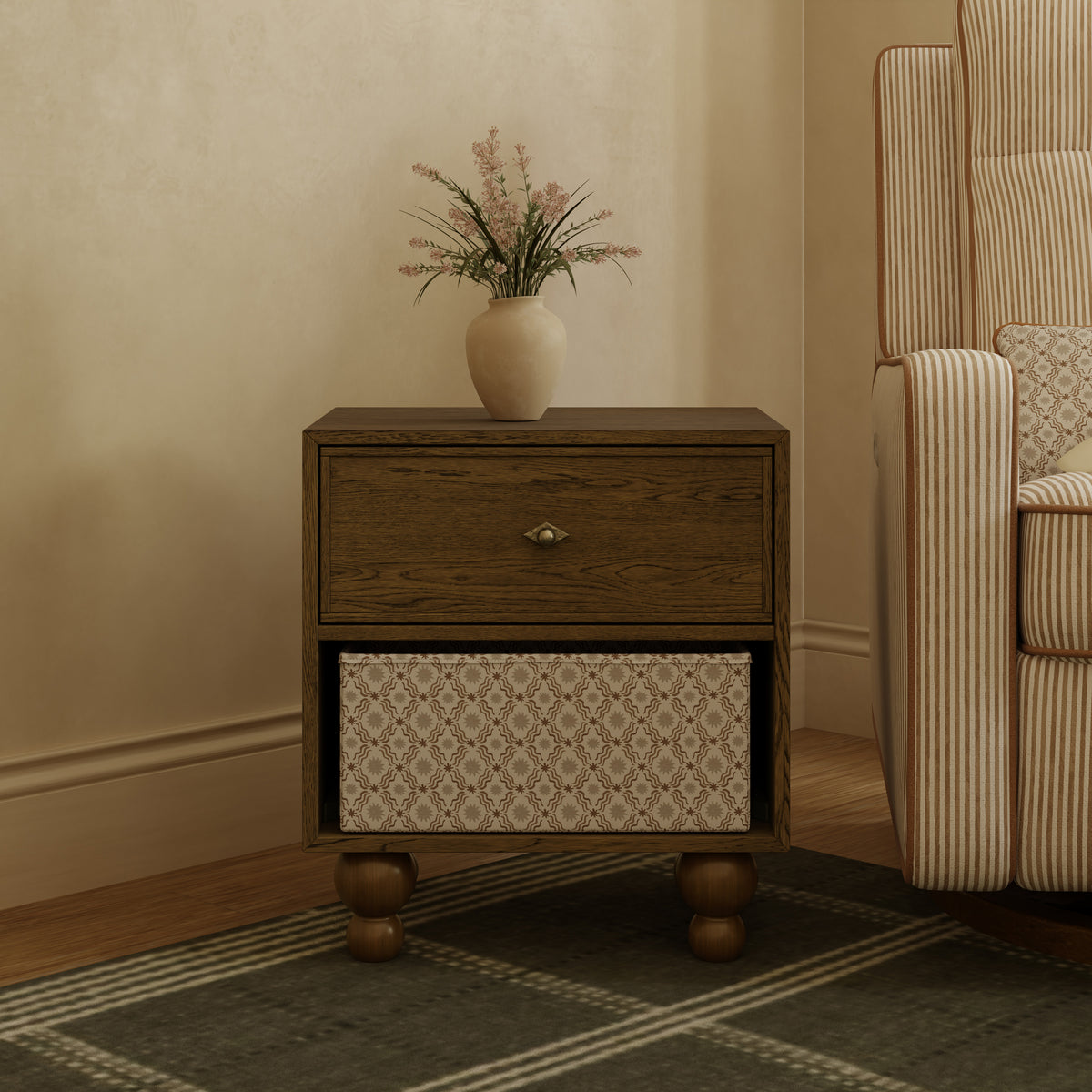 Babyletto wooden nightstand with one drawer and an open shelf containing a patterned storage bin