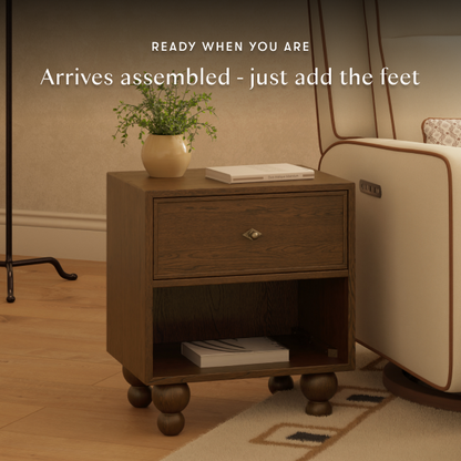Babyletto wooden nightstand with one drawer and open shelf on round feet