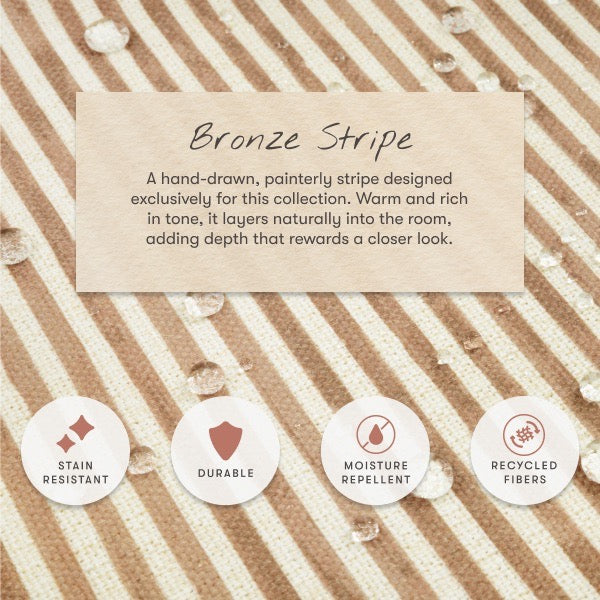 Babyletto bronze stripe fabric swatch with water droplets and icons for stain resistant durable and recycled features
