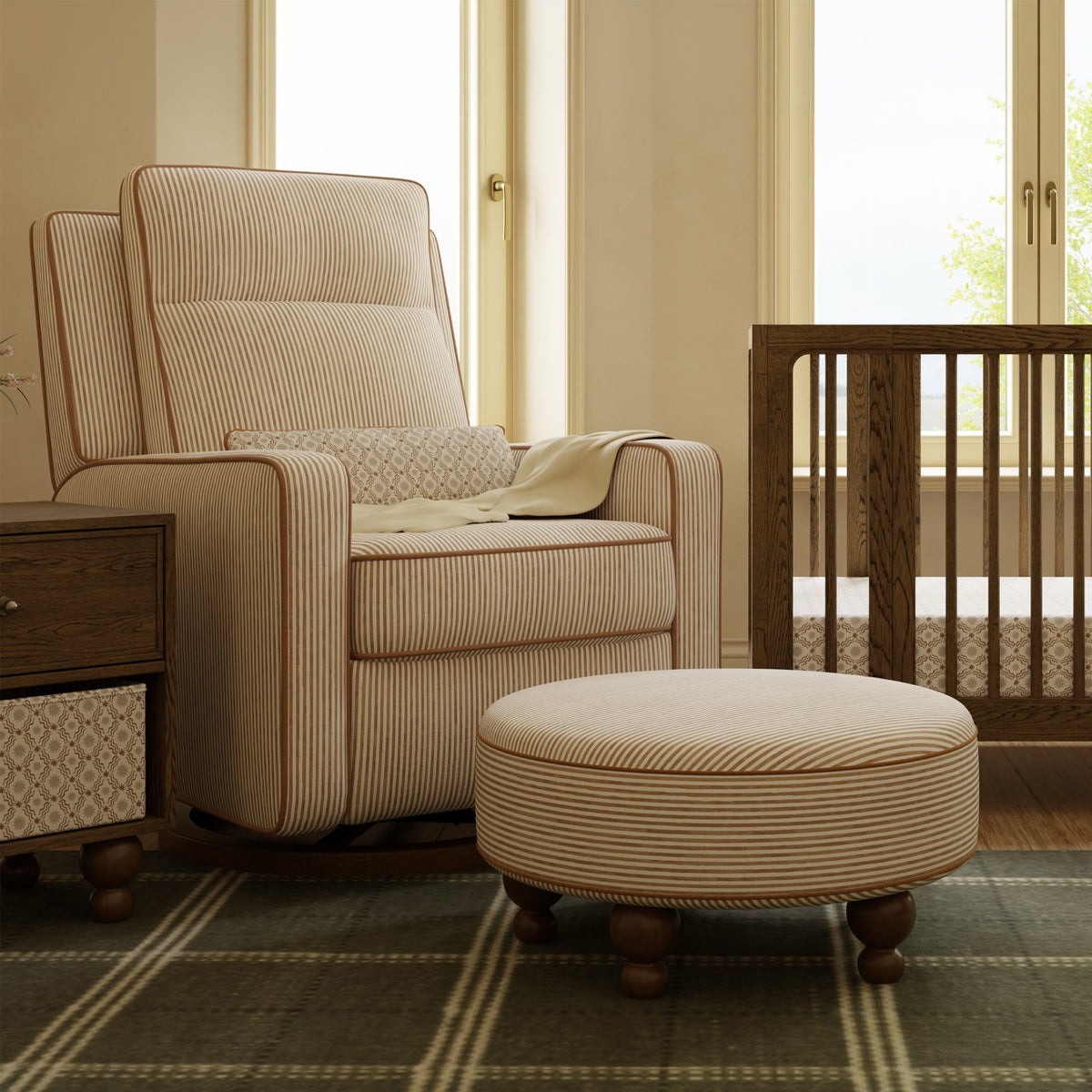 Babyletto striped nursery glider and matching round ottoman in a room with a wooden crib
