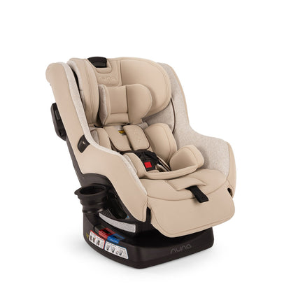 Nuna convertible car seat in beige with five point harness and cup holder