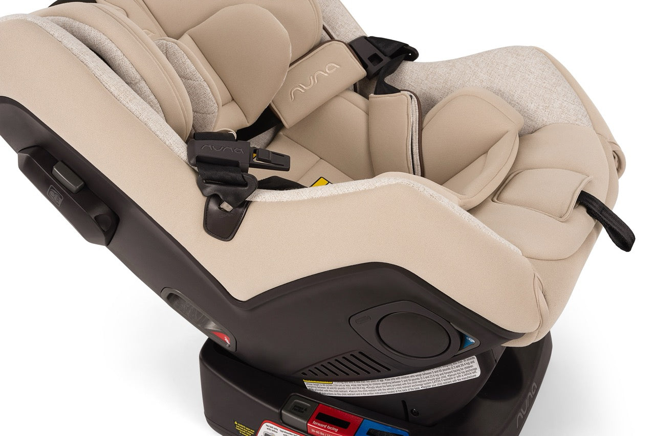 Nuna convertible car seat in beige fabric