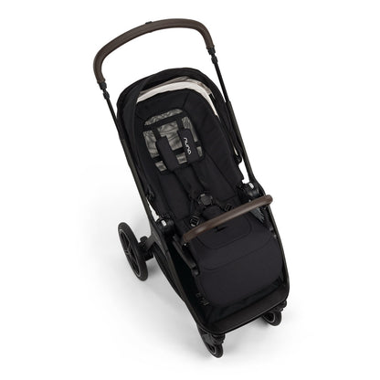 Nuna black stroller with brown leather handle and bumper bar
