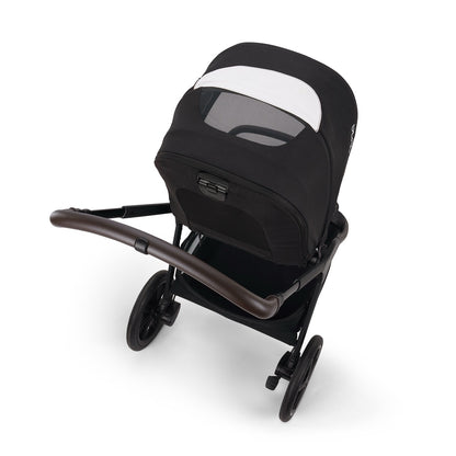 Nuna stroller with black canopy and brown leather handle viewed from above