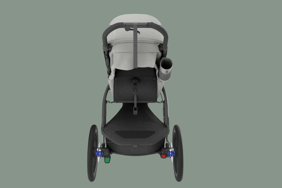Light gray baby stroller with black frame, three wheels, and cup holder, viewed from rear against muted green background.