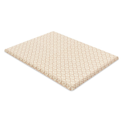 Babyletto crib mattress with a tan and white geometric pattern