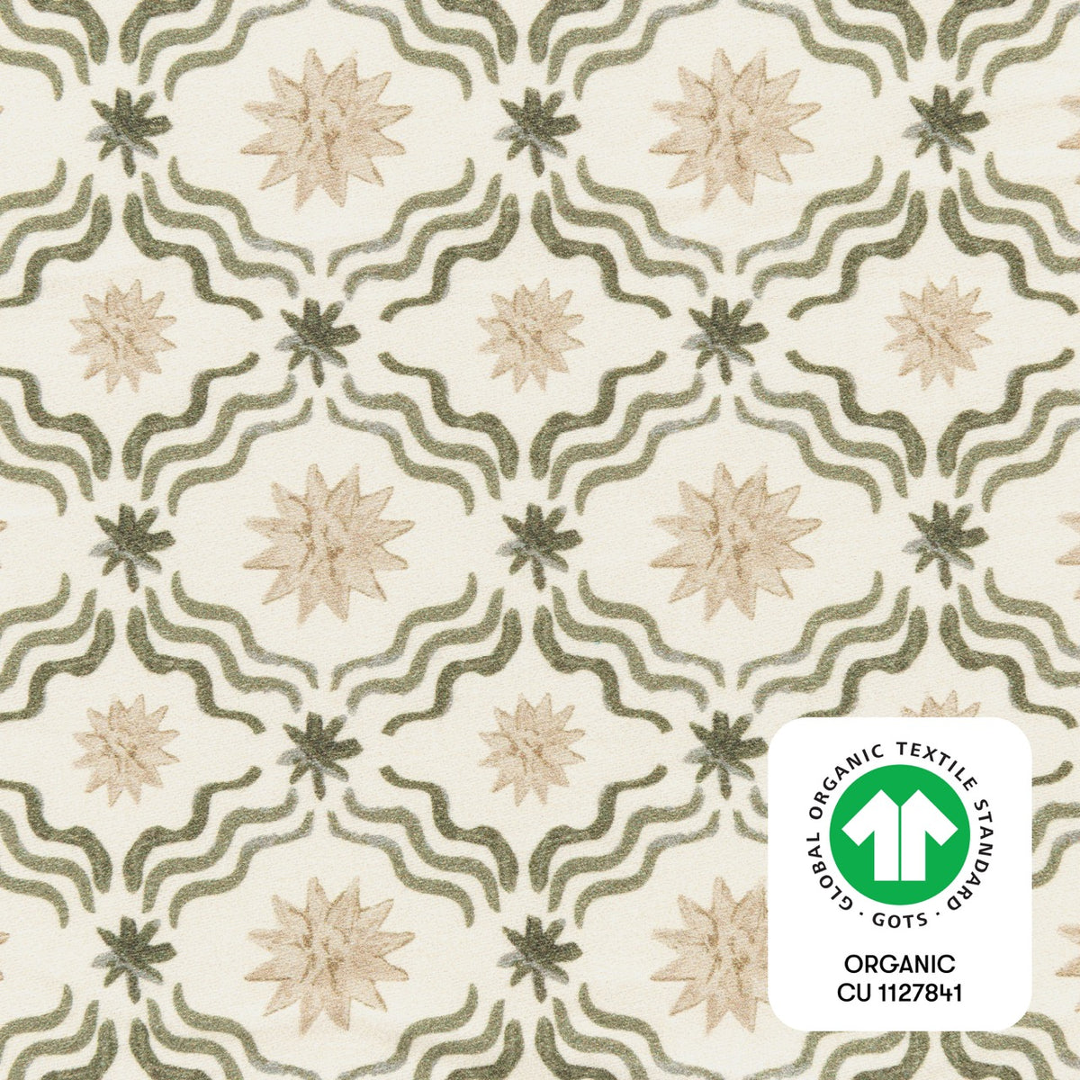 Babyletto fabric with green wavy lines and beige star patterns featuring a GOTS organic certification label