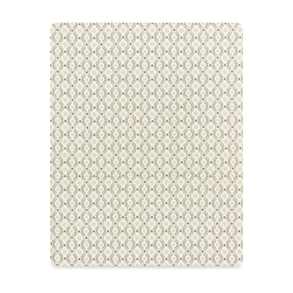 Babyletto crib sheet with beige and sage green geometric lattice pattern