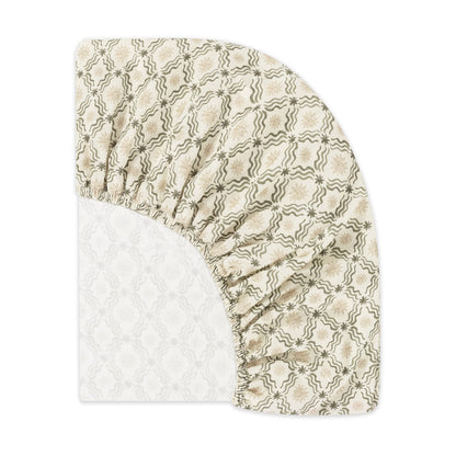 Babyletto fitted crib sheet with green and beige star and wave pattern