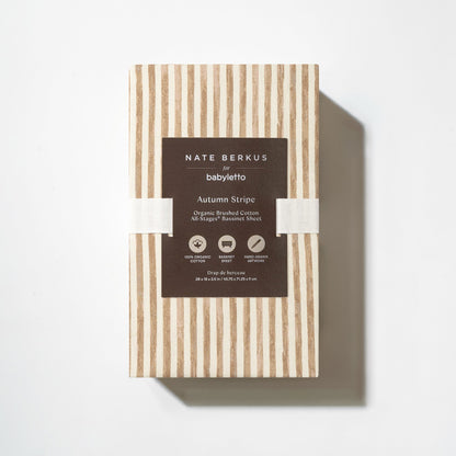 Babyletto Nate Berkus organic cotton bassinet sheet in autumn stripe pattern in packaging
