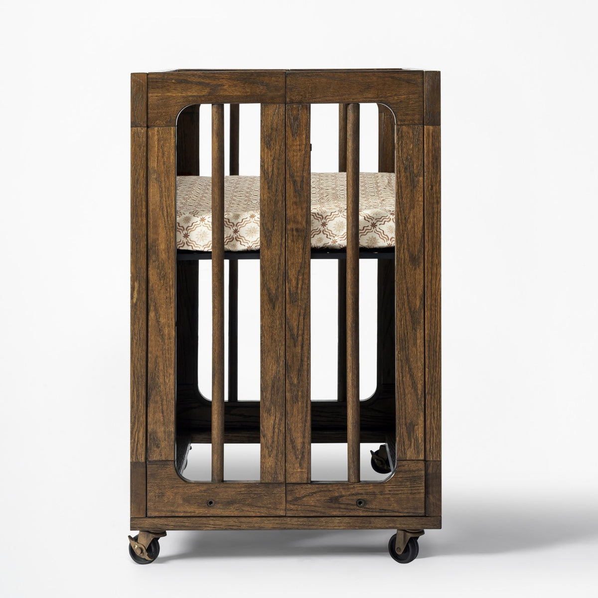Babyletto wooden bassinet with slatted sides and wheels