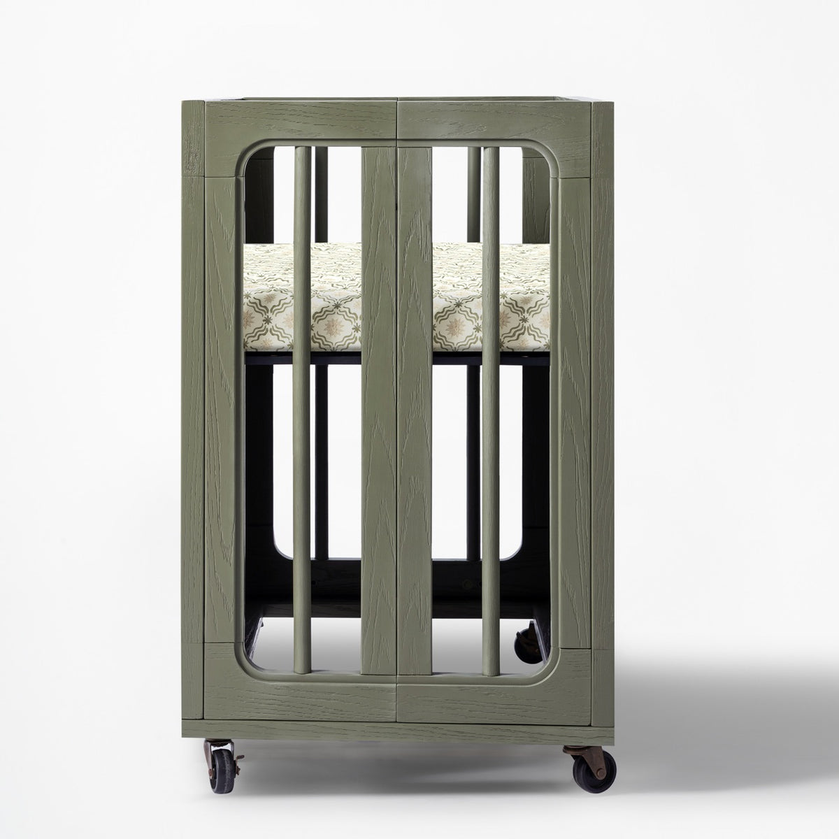 Babyletto olive green wooden bassinet with patterned mattress and wheels