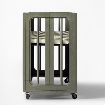 Babyletto olive green wooden bassinet with striped mattress on wheels