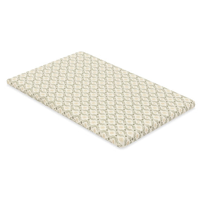 Babyletto crib mattress with cream and sage green wavy grid pattern