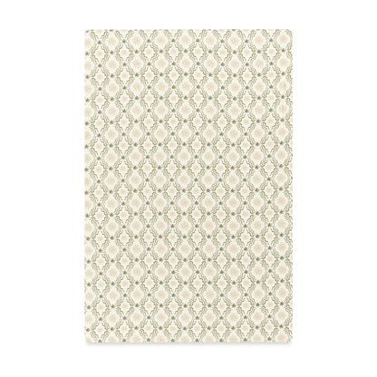 Babyletto crib sheet with a repeating green and cream diamond floral pattern