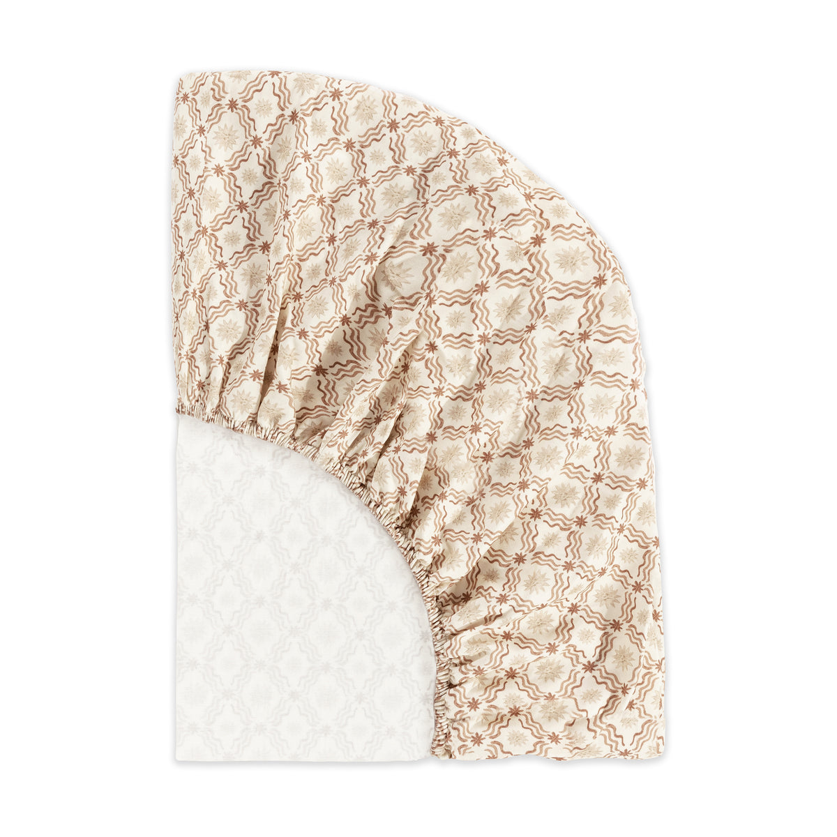 Babyletto fitted crib sheet with tan floral and wavy line pattern