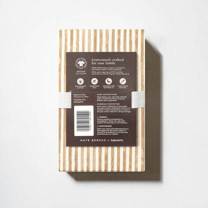 Babyletto crib sheet packaging with product information and care instructions