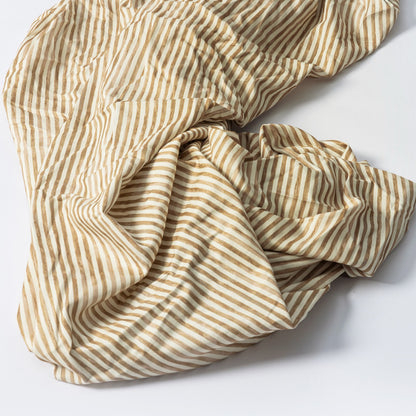 Babyletto crib sheet with tan and white vertical stripes