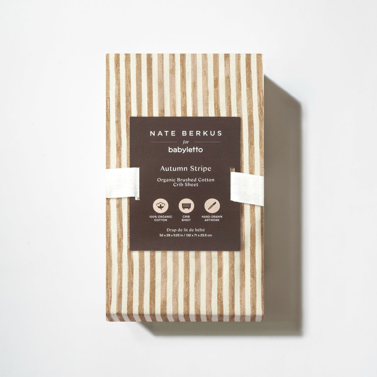 Babyletto Nate Berkus organic brushed cotton crib sheet in autumn stripe pattern in packaging