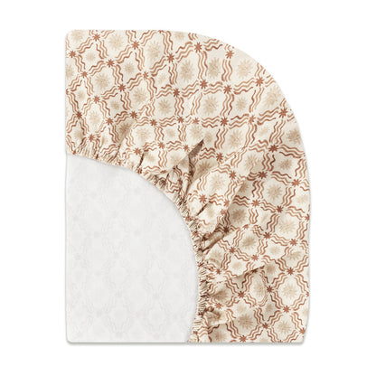 Babyletto fitted crib sheet with tan and brown star and wavy line pattern